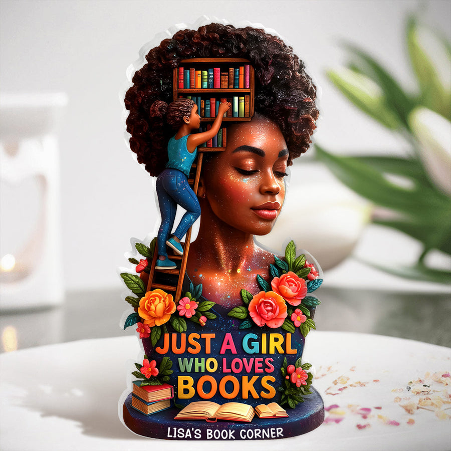 Hands holding the personalized plaque in front of a bookshelf