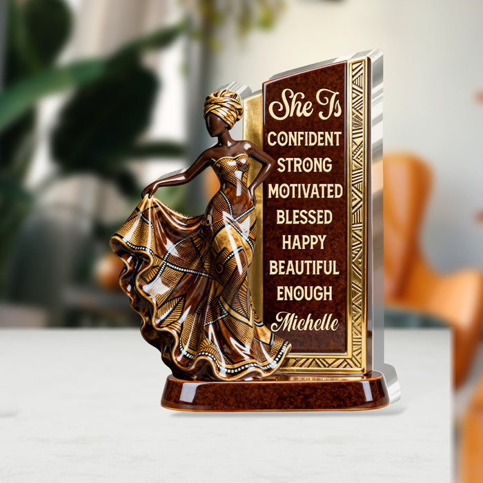She Is Confident plaque displayed beside fresh flowers