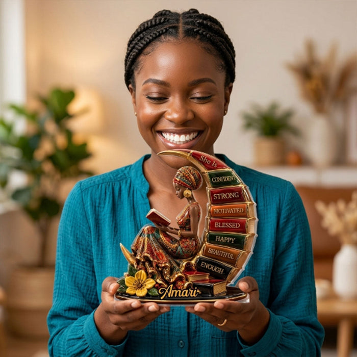 Woman smiling while holding her personalized plaque