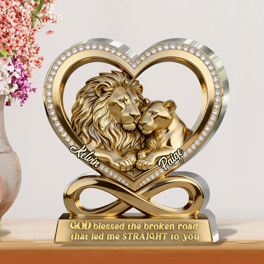 Hands holding the personalized plaque in front of a bookshelf