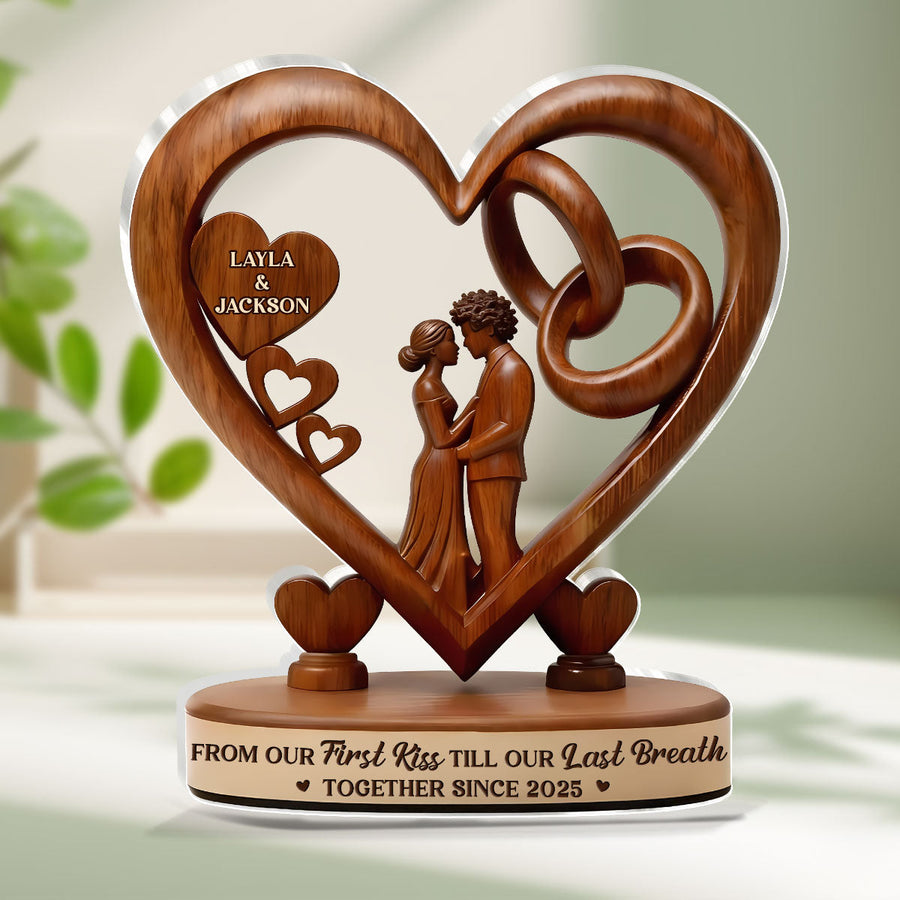 Hands holding the personalized plaque in front of a bookshelf