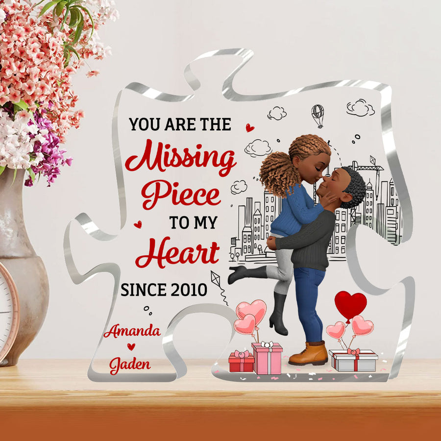 Hands holding the personalized plaque in front of a bookshelf