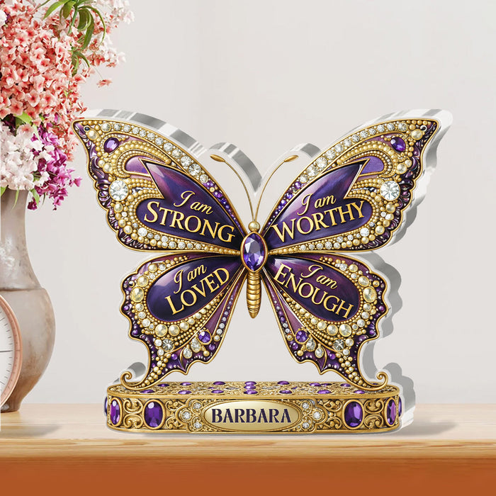 She Is Confident plaque displayed beside fresh flowers