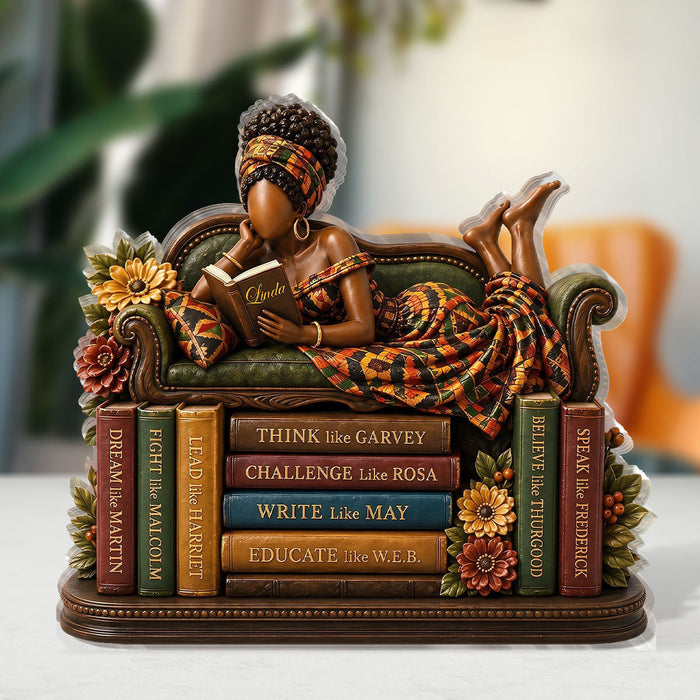 Woman smiling while holding her personalized plaque